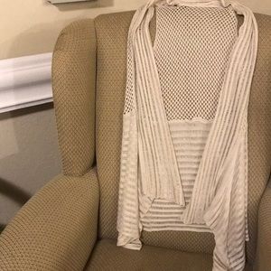 Cute cream colored sleeveless cardi.